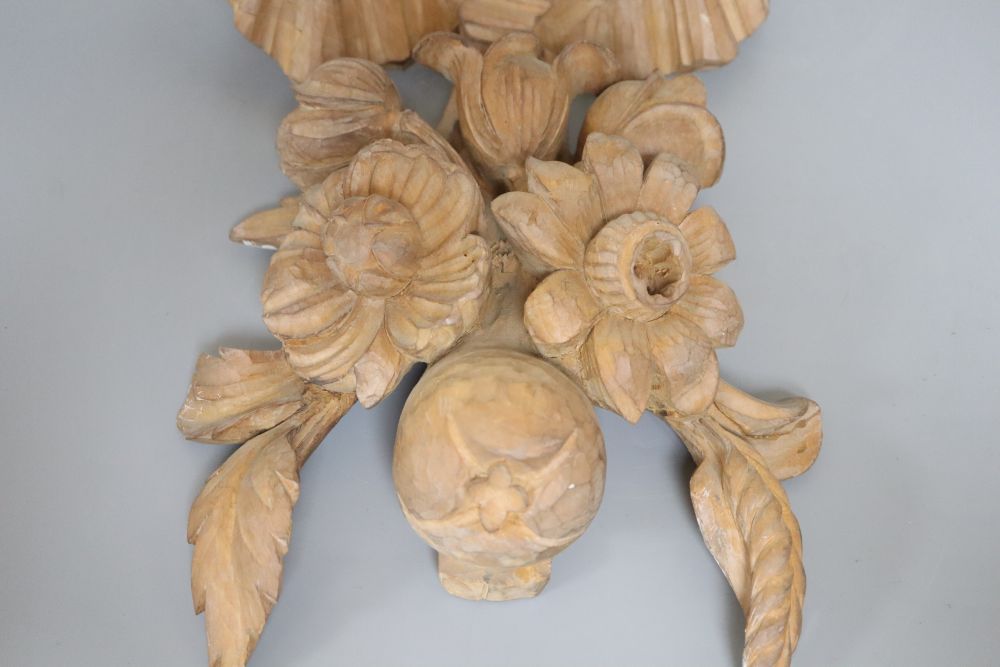 A carved beech ribbon and fruit wall applique, length 47cm